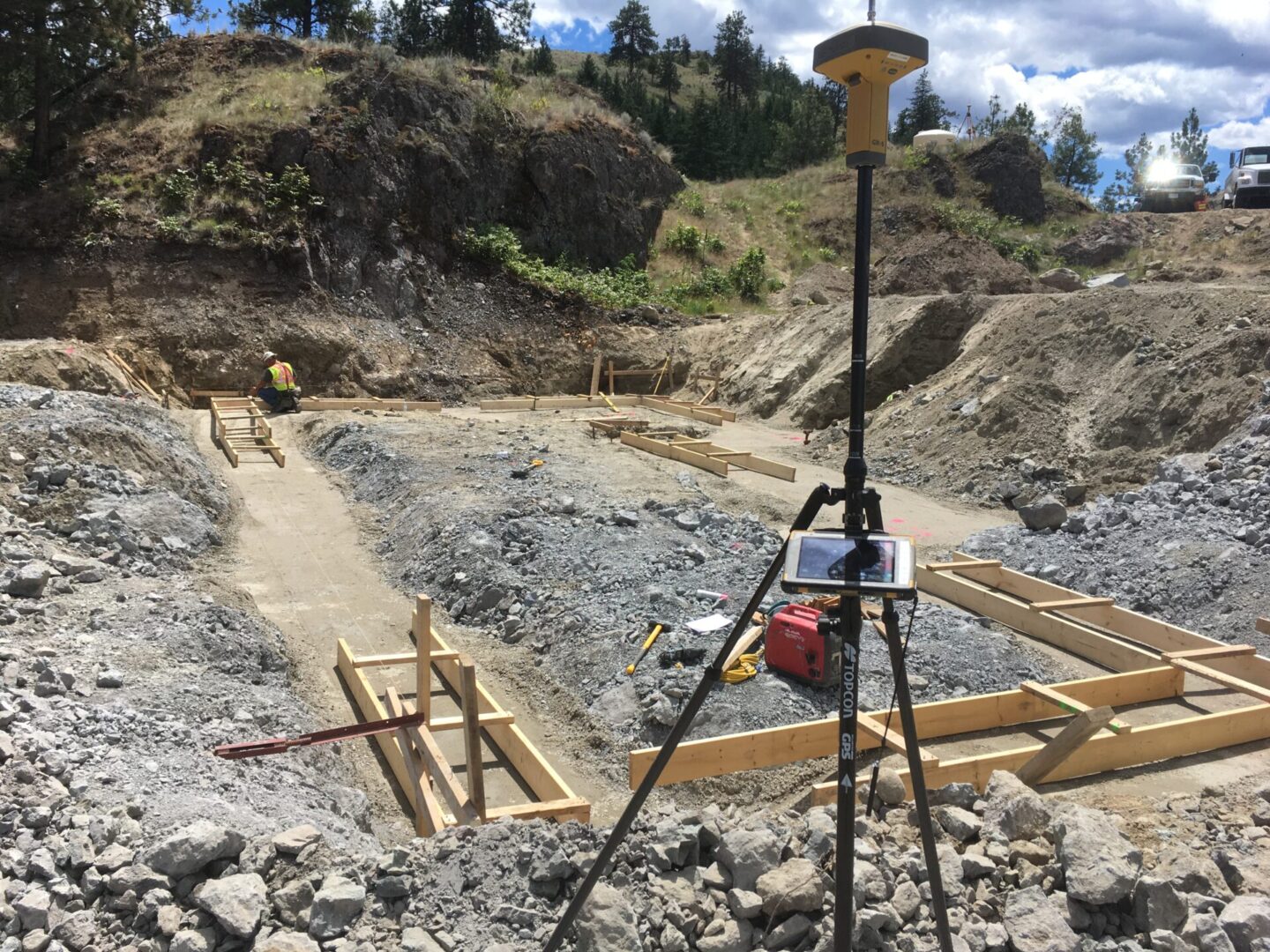 A construction site with a tripod and light