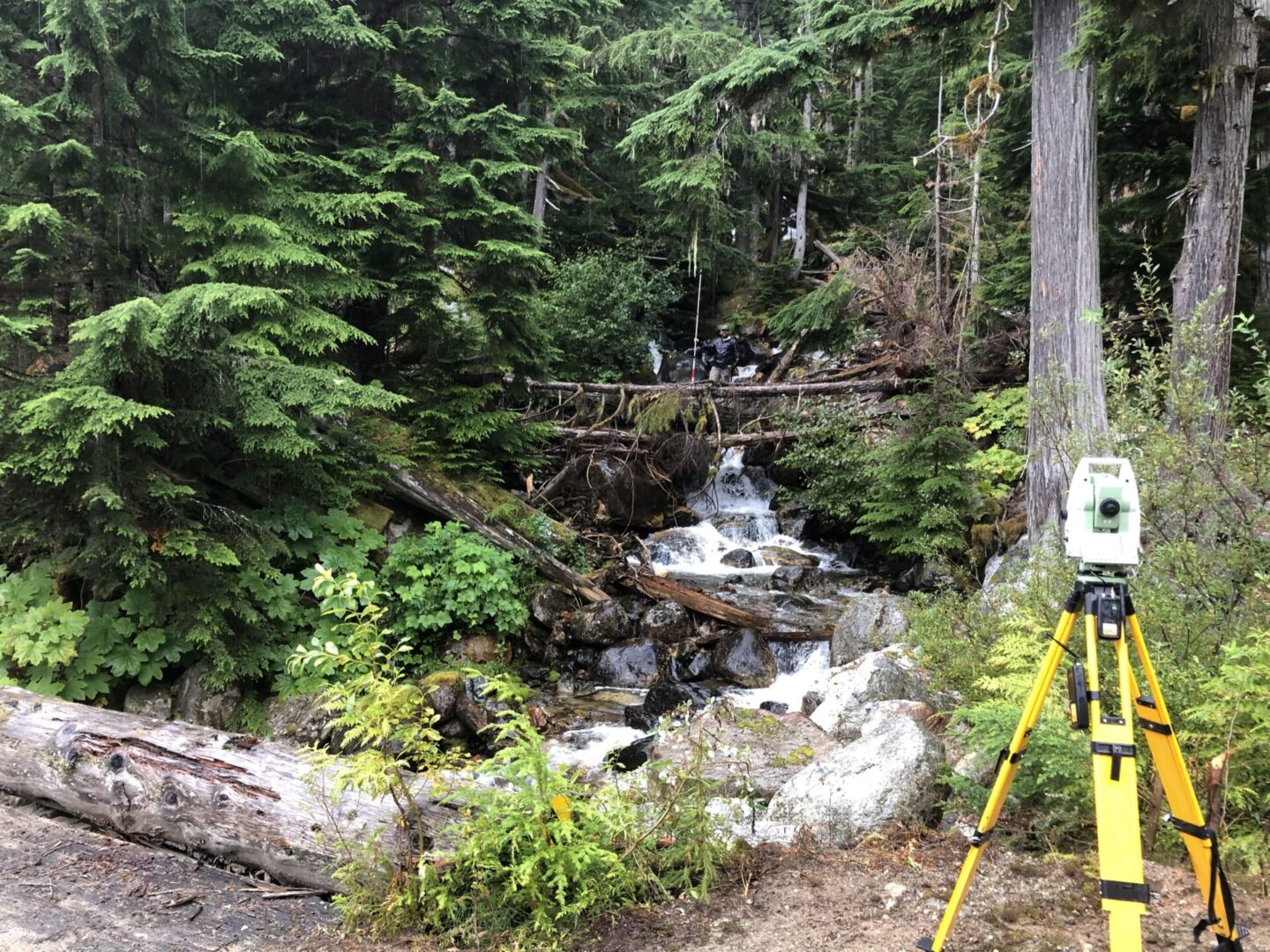 A camera is set up to take pictures of the waterfall.